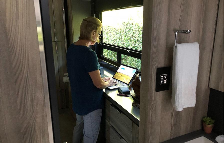 Terry using dresser as stand-up desk